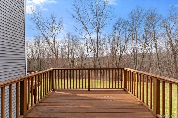 a view of balcony with wooden floor