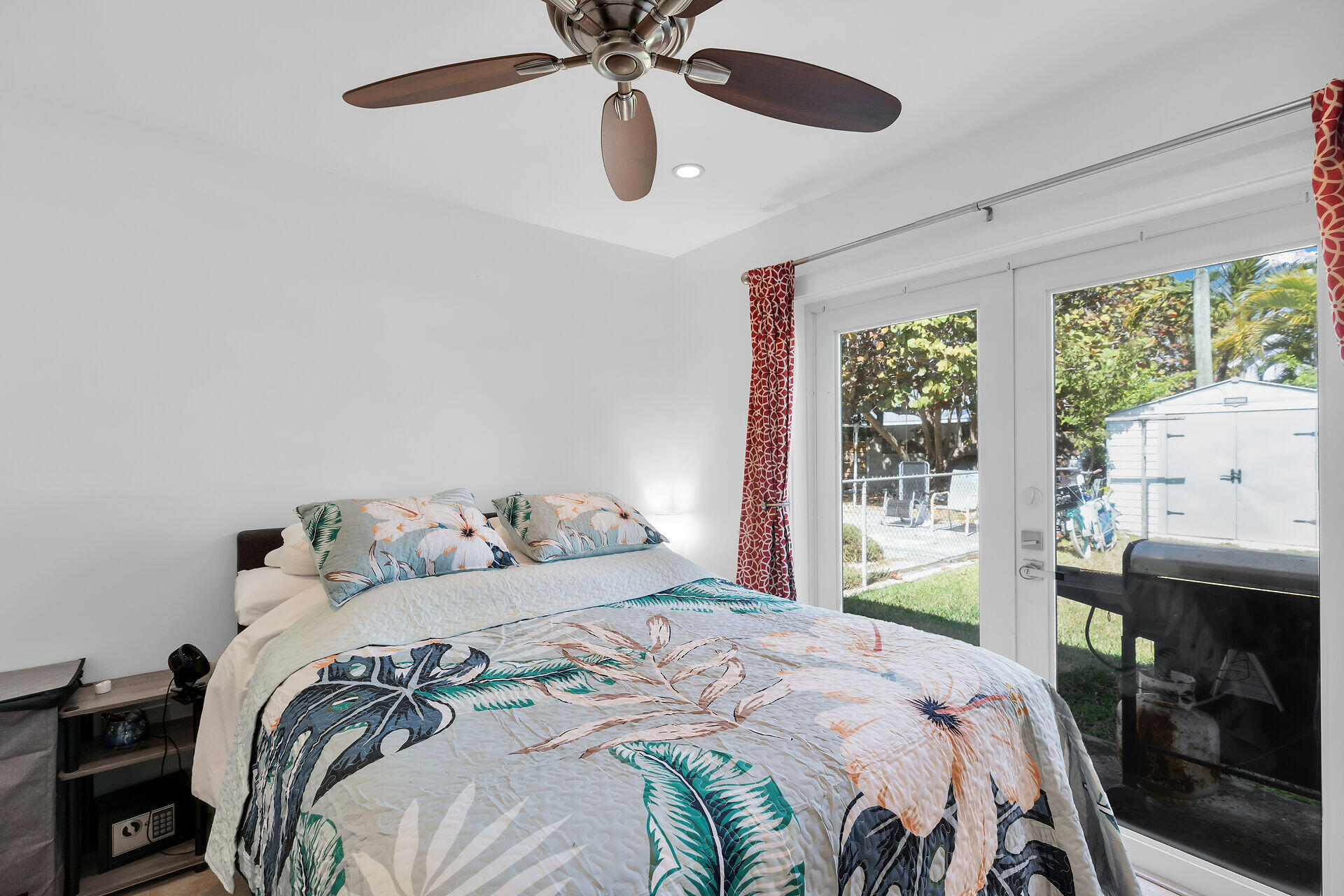 1440 17th Street Key West, FL 33040 - Photo 30 of 37 a bedroom with a bed and a chandelier