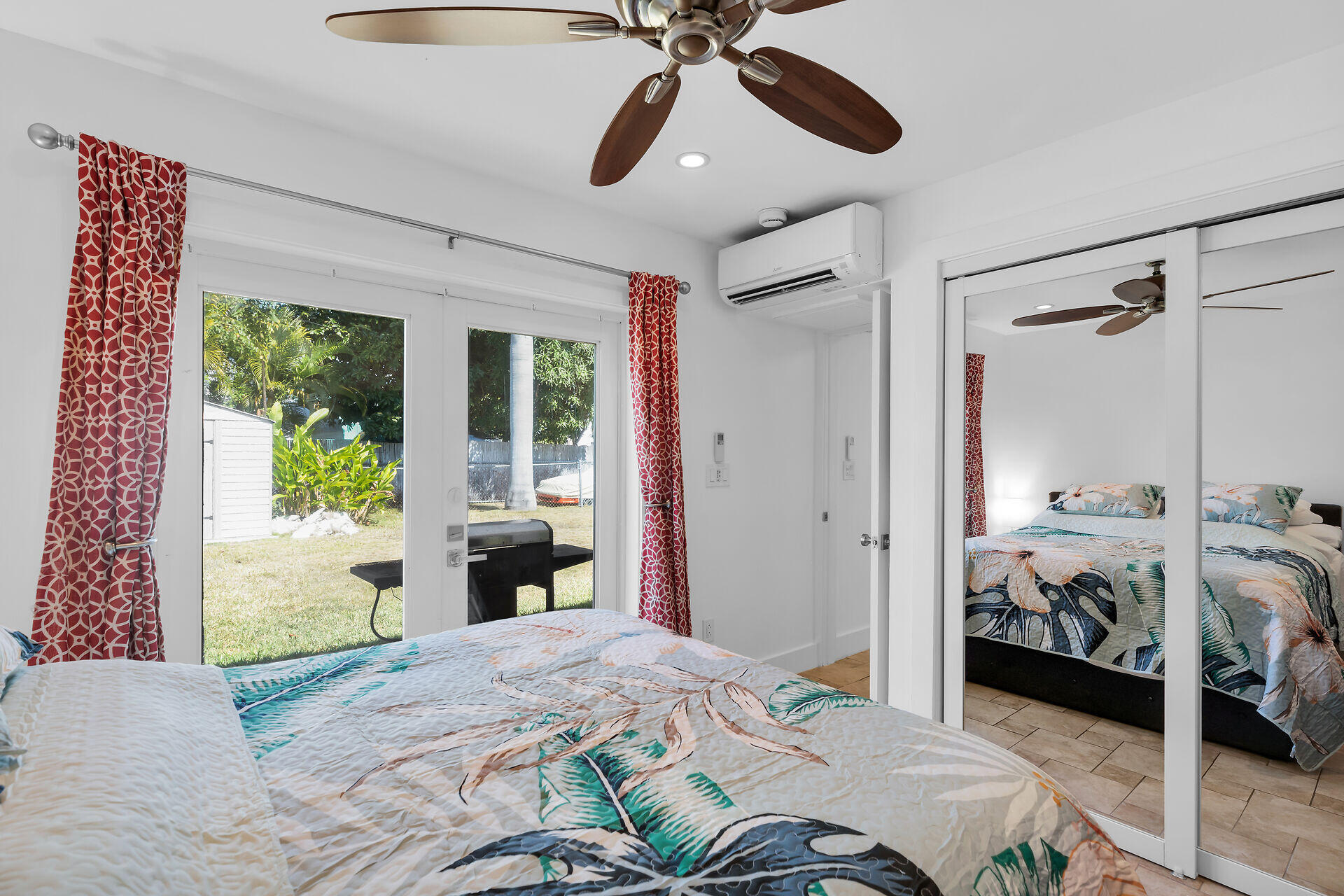 1440 17th Street Key West, FL 33040 - Photo 31 of 37 a bedroom with a bed and a window