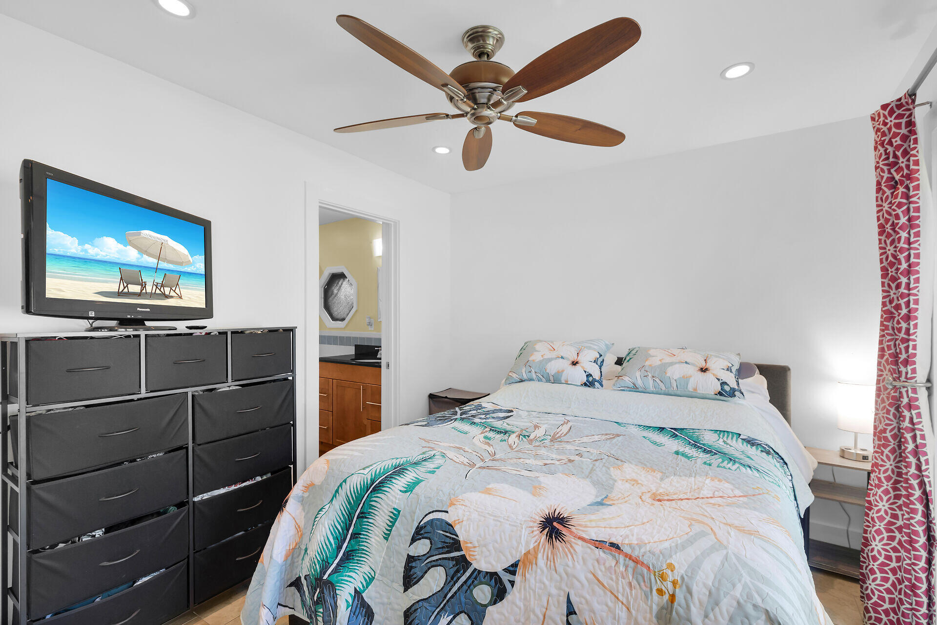 1440 17th Street Key West, FL 33040 - Photo 32 of 37 a bedroom with a bed and a flat screen tv