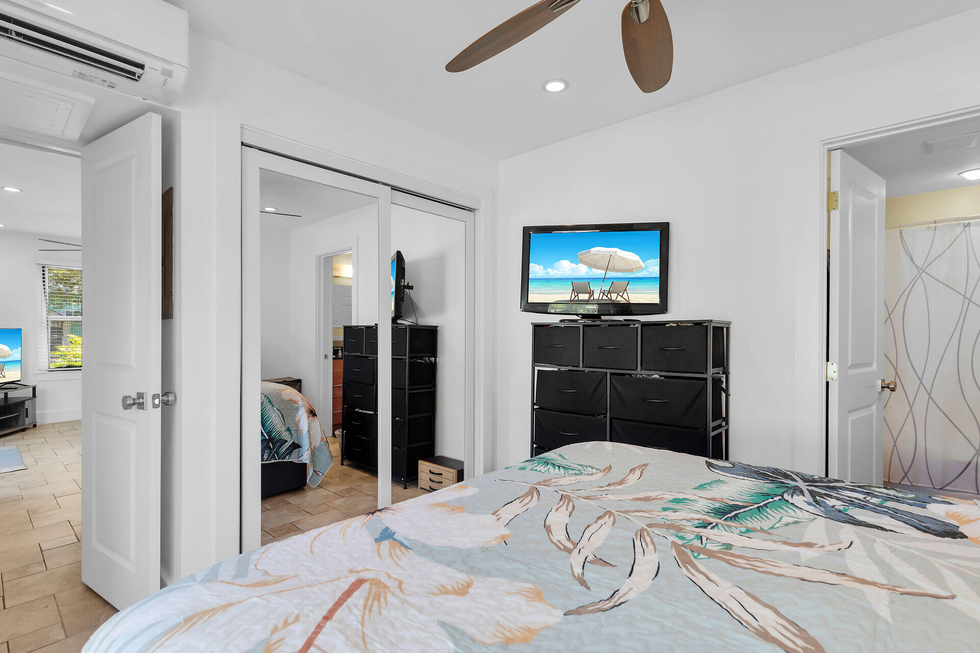 1440 17th Street Key West, FL 33040 - Photo 33 of 37 a bedroom with a bed and wooden floor