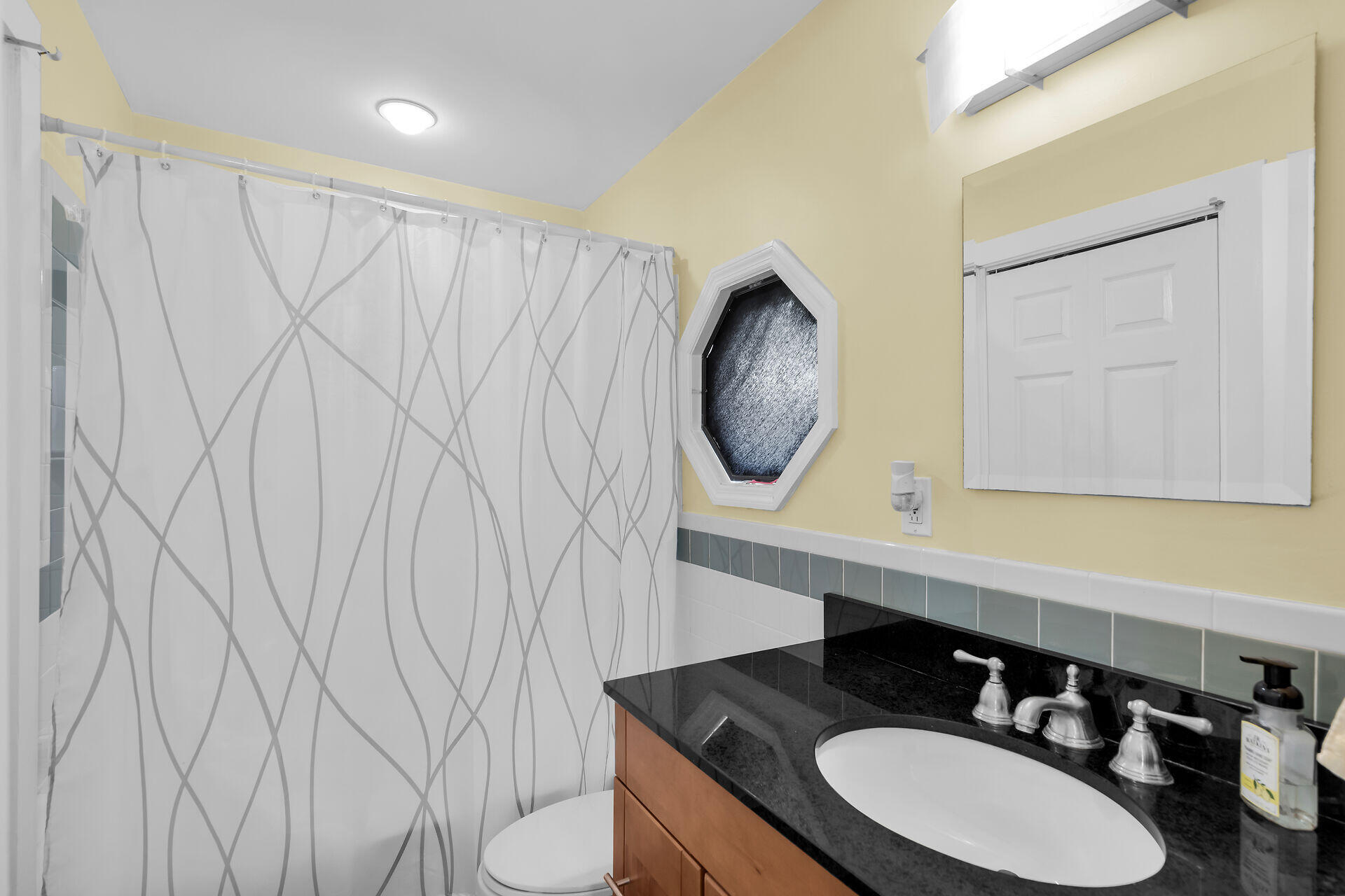 1440 17th Street Key West, FL 33040 - Photo 34 of 37 a bathroom with a sink vanity mirror and vanity