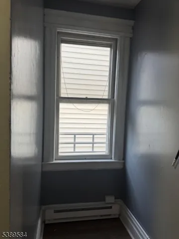 a view of a room that has a window in it