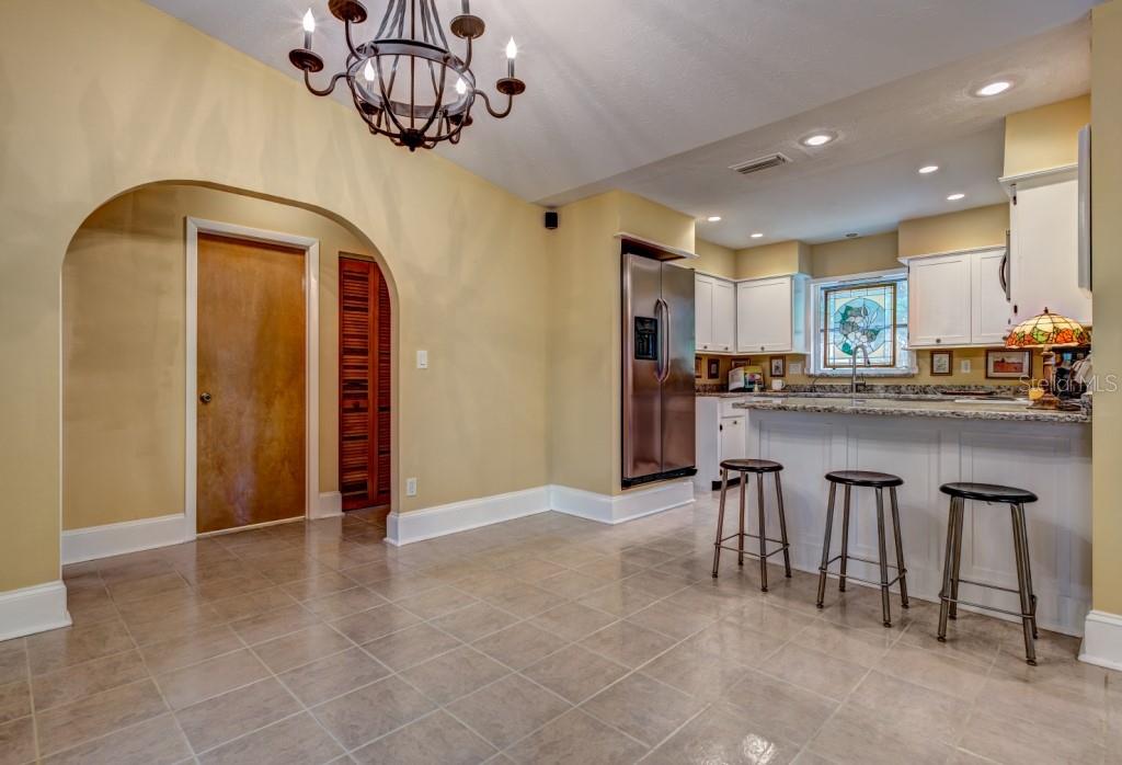 1453 Nantucket Road Venice, FL 34293 - Photo 12 of 35 The dining area looking into the updated kitchen with roomy breakfast bar.