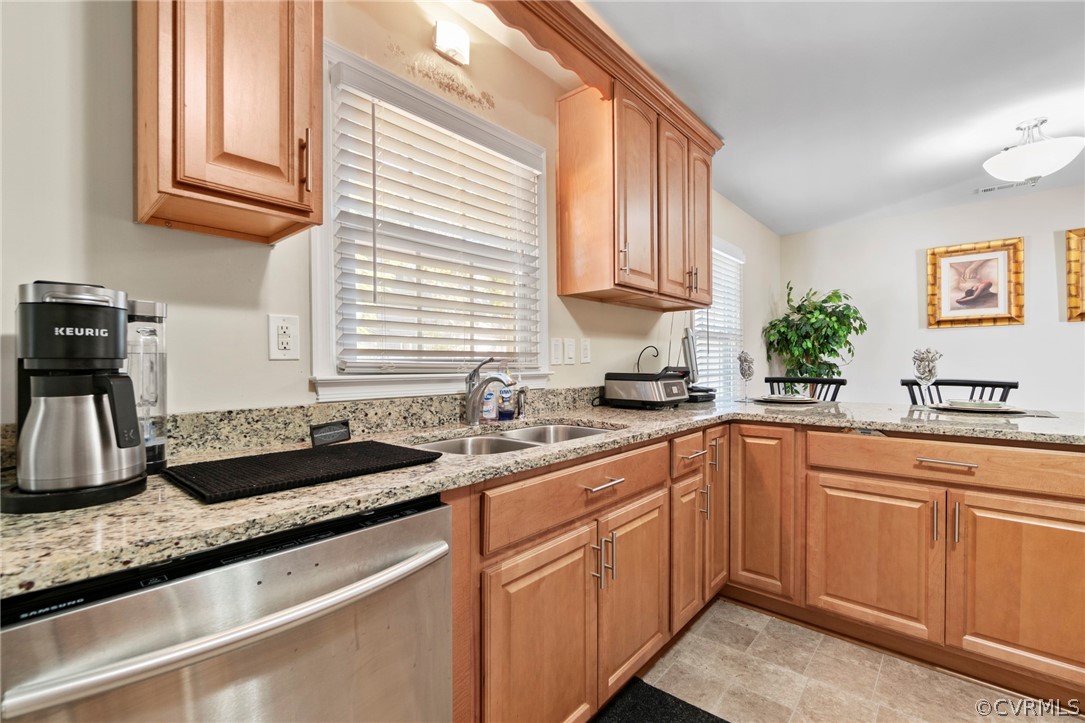 6209 Walderbrook Road Richmond, VA 23234 - Photo 12 of 35 a kitchen with granite countertop a sink and white cabinets