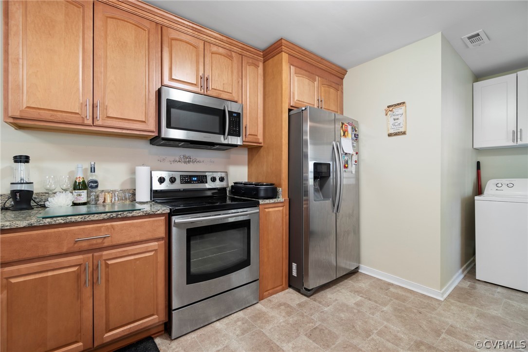 6209 Walderbrook Road Richmond, VA 23234 - Photo 15 of 35 a kitchen with stainless steel appliances granite countertop a refrigerator stove and microwave