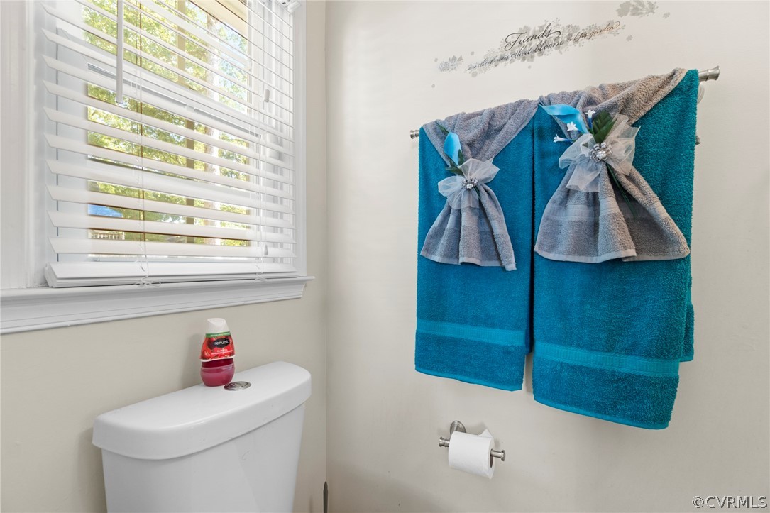 6209 Walderbrook Road Richmond, VA 23234 - Photo 22 of 35 a bathroom with a toilet sink and curtain