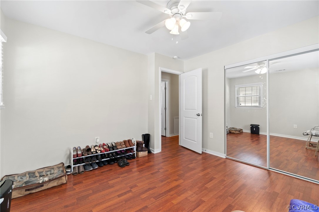 6209 Walderbrook Road Richmond, VA 23234 - Photo 25 of 35 an empty room with wooden floor and a ceiling fan