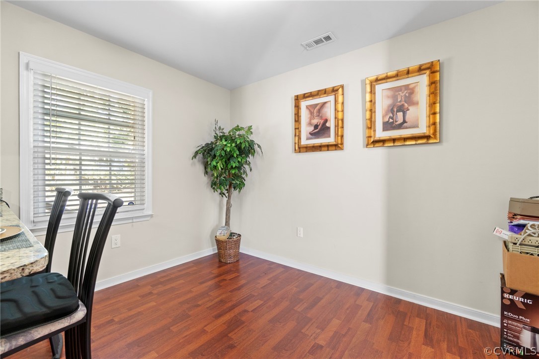 6209 Walderbrook Road Richmond, VA 23234 - Photo 26 of 35 a view of a room with a large window and wooden floor