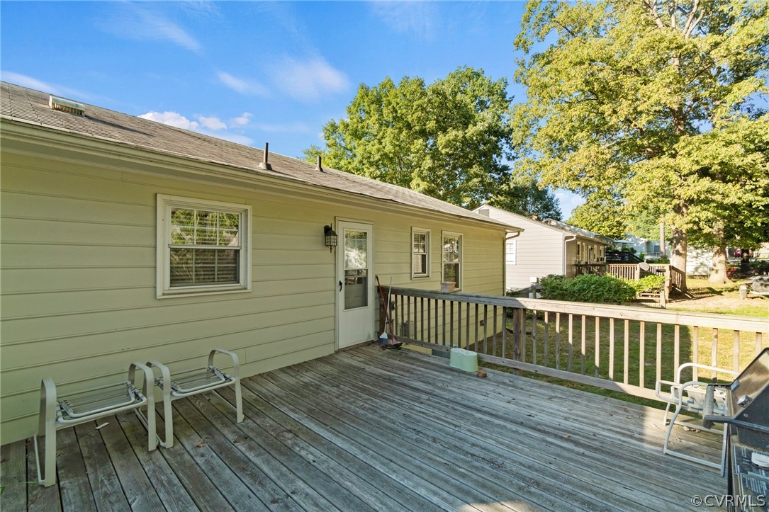 6209 Walderbrook Road Richmond, VA 23234 - Photo 28 of 35 a view of a chair and table on the wooden deck
