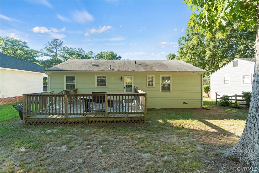 6209 Walderbrook Road Richmond, VA 23234 - Photo 32 of 35 a view of a house with wooden fence and a trees