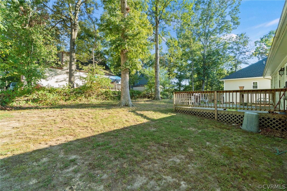 6209 Walderbrook Road Richmond, VA 23234 - Photo 34 of 35 a view of a garden with a bench