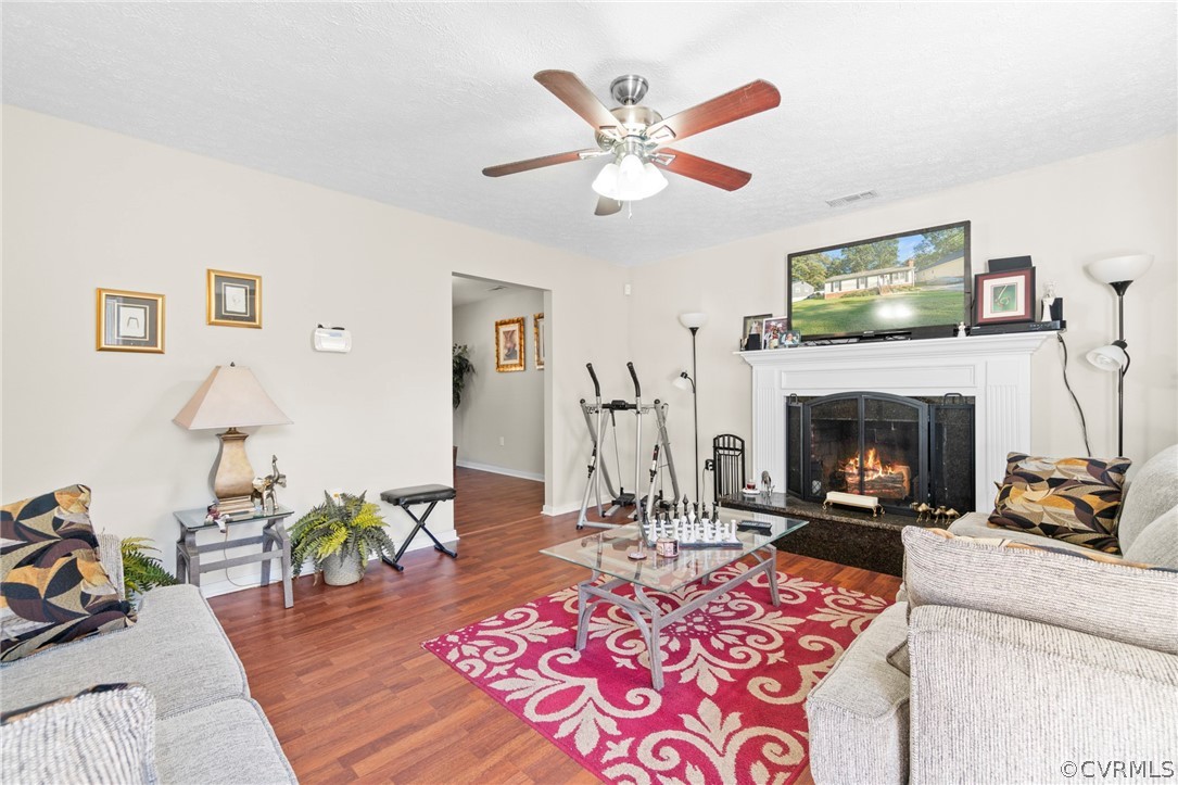 6209 Walderbrook Road Richmond, VA 23234 - Photo 5 of 35 a living room with furniture and a fireplace
