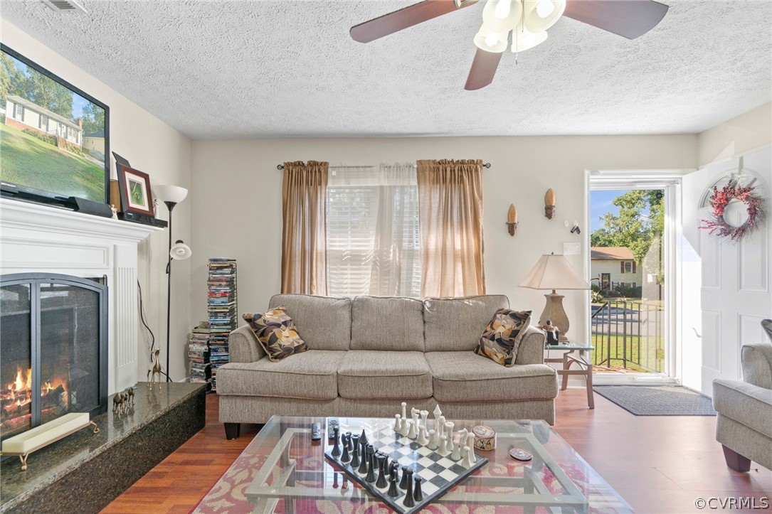 6209 Walderbrook Road Richmond, VA 23234 - Photo 7 of 35 a living room with furniture and a fireplace