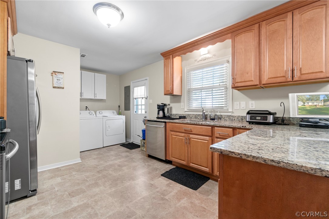 6209 Walderbrook Road Richmond, VA 23234 - Photo 9 of 35 a kitchen with granite countertop a sink a counter space appliances and cabinets