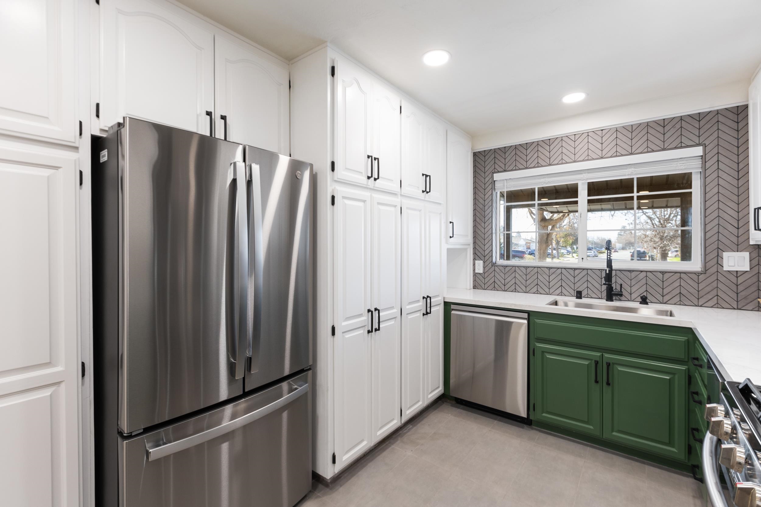 38952 Emrol Avenue Fremont, CA 94536 - Photo 17 of 59 a kitchen with stainless steel appliances granite countertop a refrigerator and a sink