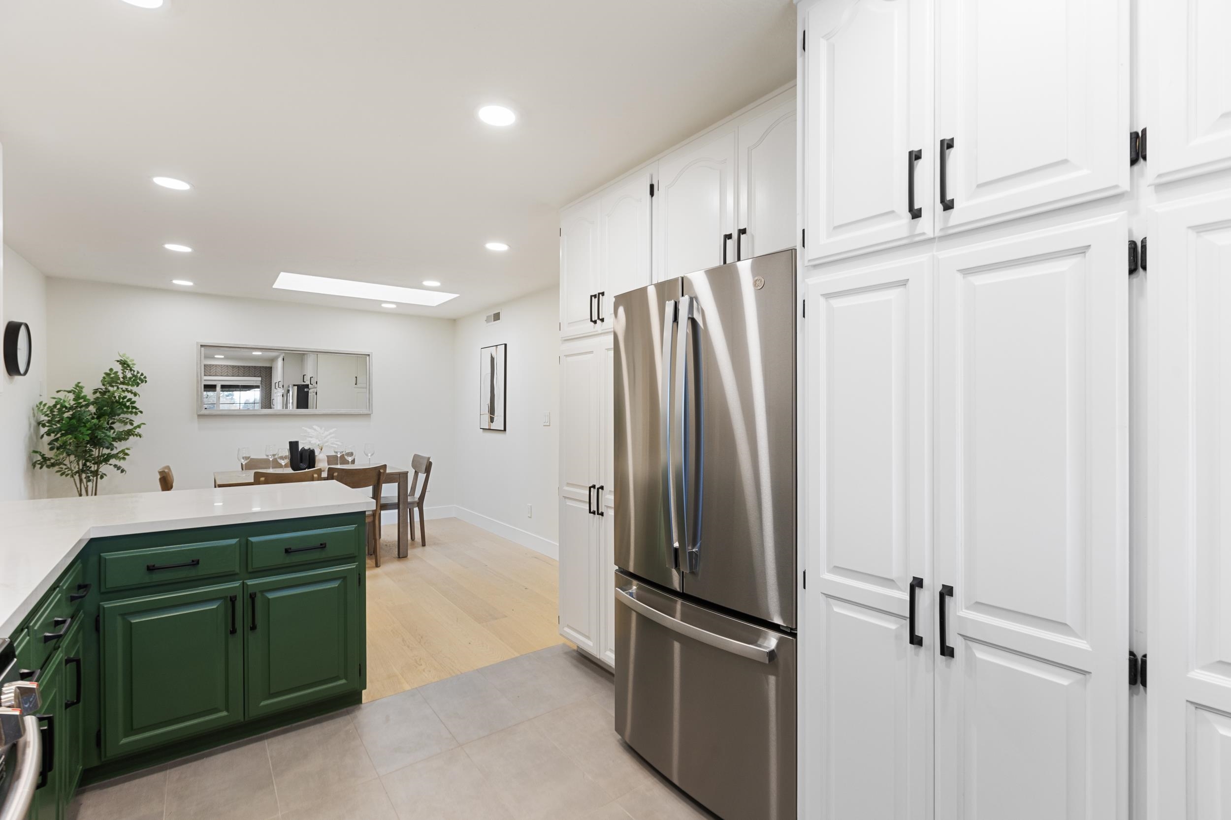 38952 Emrol Avenue Fremont, CA 94536 - Photo 19 of 59 a kitchen with stainless steel appliances kitchen island granite countertop a refrigerator and a sink