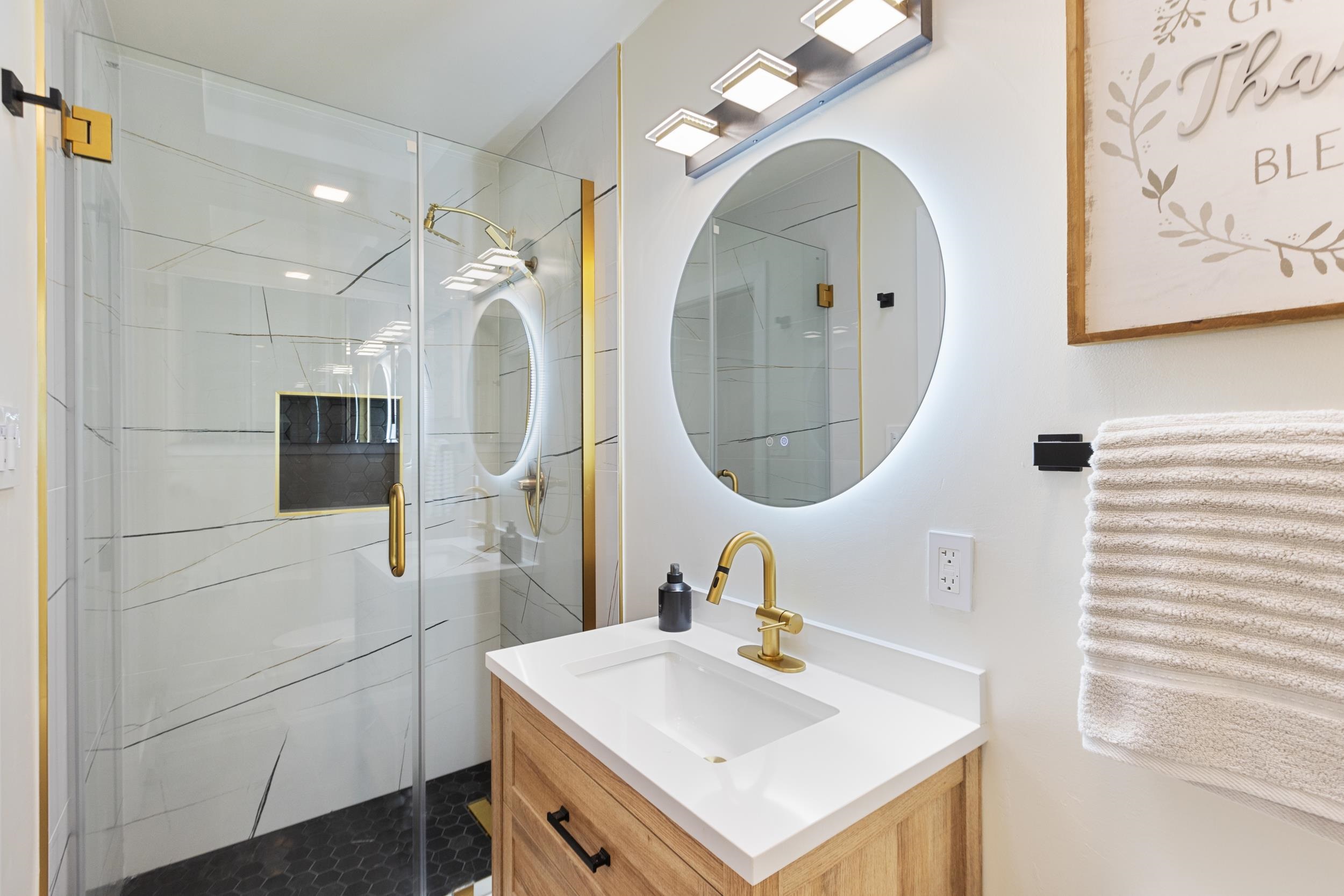 38952 Emrol Avenue Fremont, CA 94536 - Photo 27 of 59 a bathroom with a sink a mirror and a shower