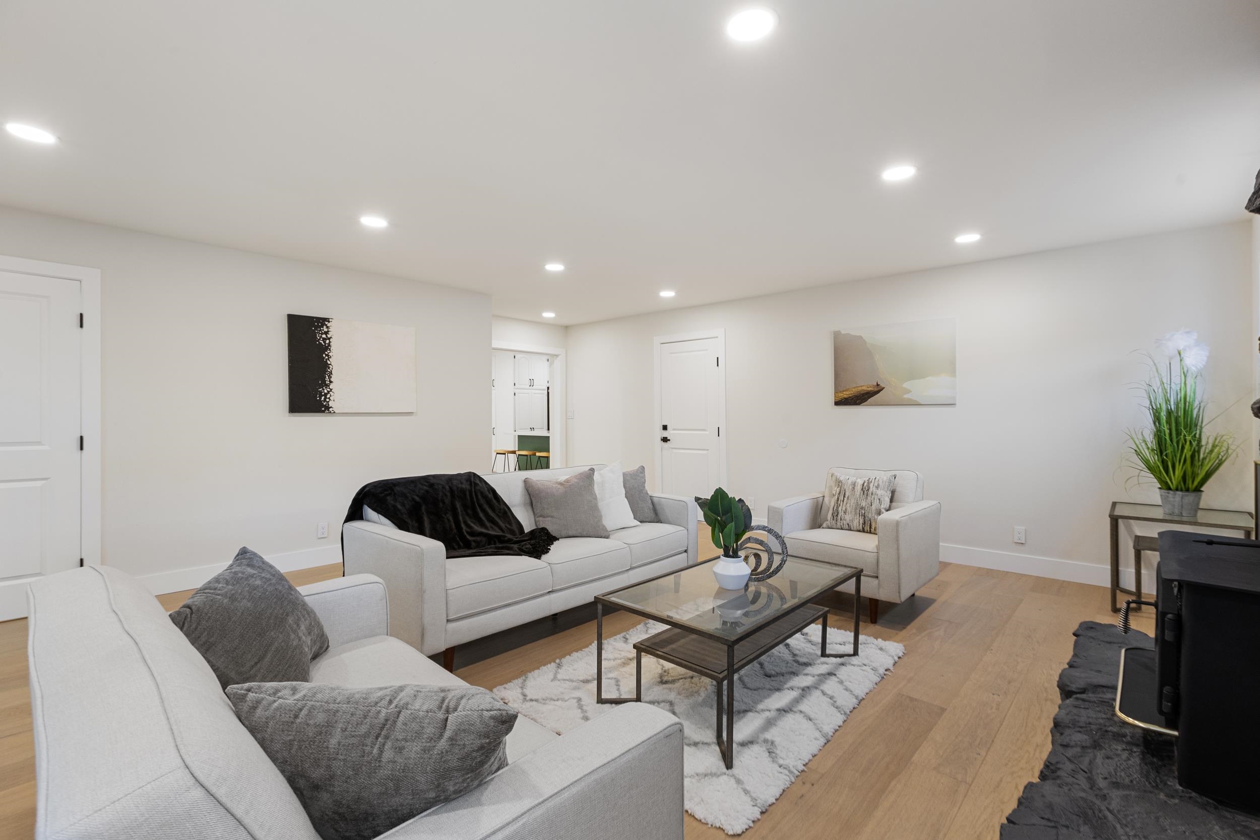 38952 Emrol Avenue Fremont, CA 94536 - Photo 35 of 59 a living room with furniture a fireplace and a potted plant