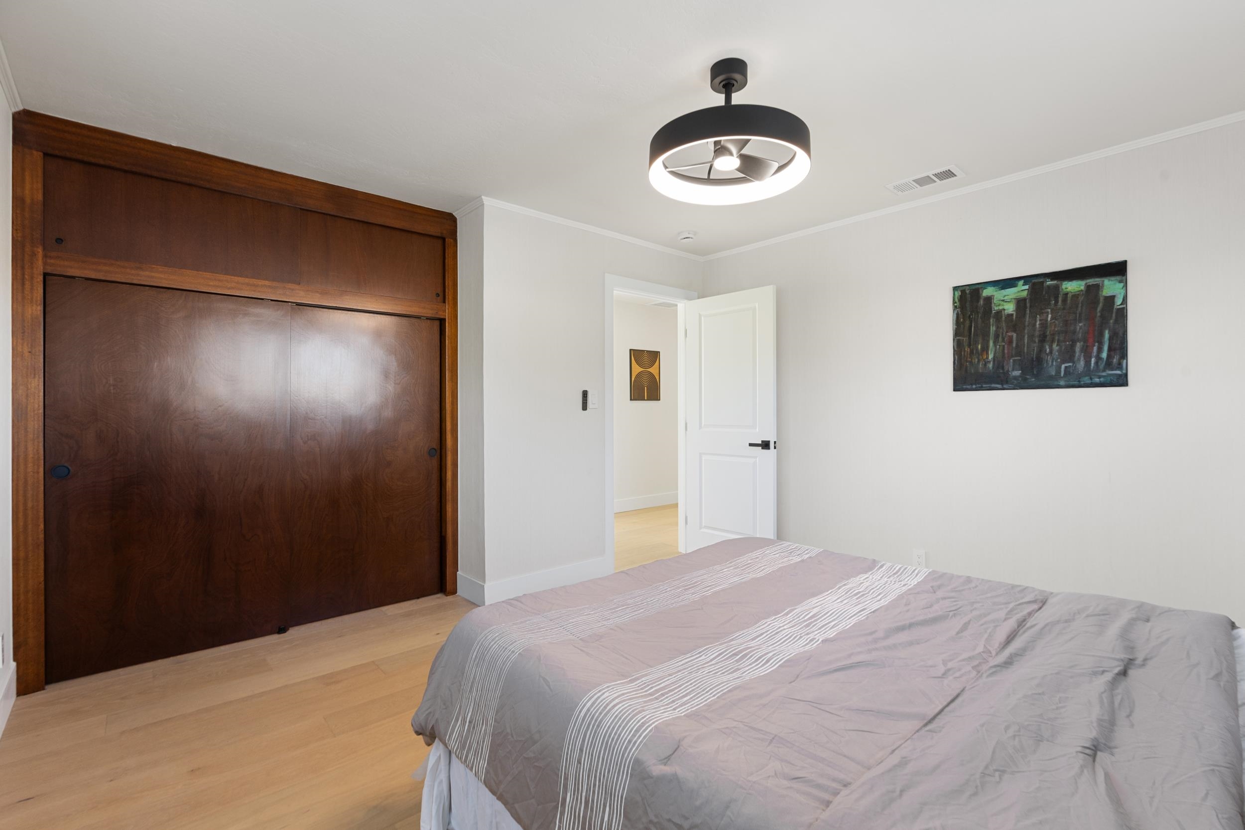 38952 Emrol Avenue Fremont, CA 94536 - Photo 44 of 59 a bedroom with a bed and a chandelier