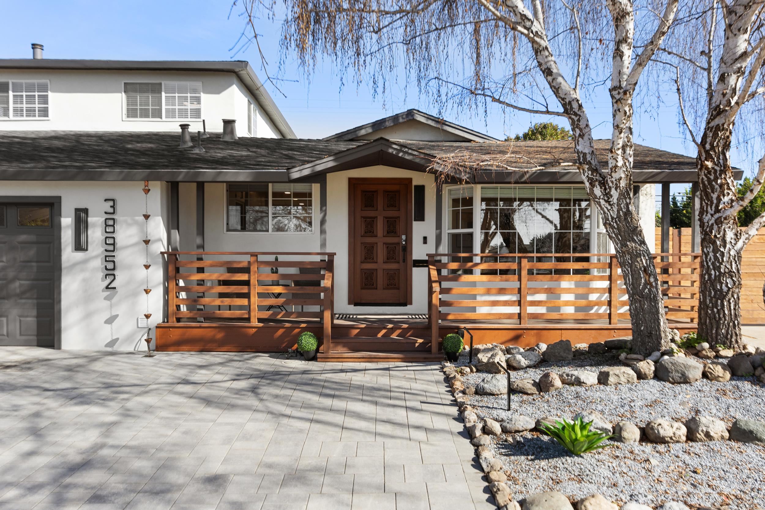 38952 Emrol Avenue Fremont, CA 94536 - Photo 6 of 59 a front view of a house with garden