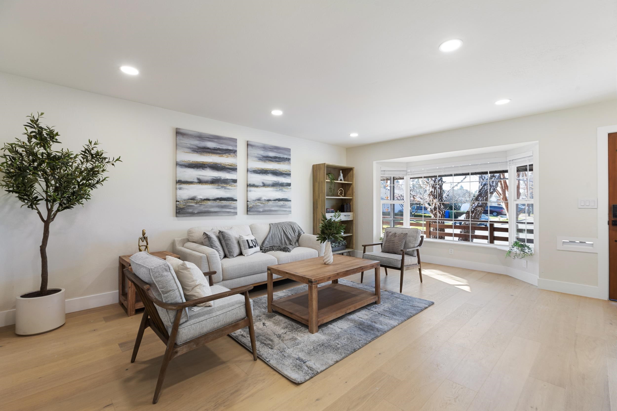 38952 Emrol Avenue Fremont, CA 94536 - Photo 10 of 59 a living room with furniture and a potted plant