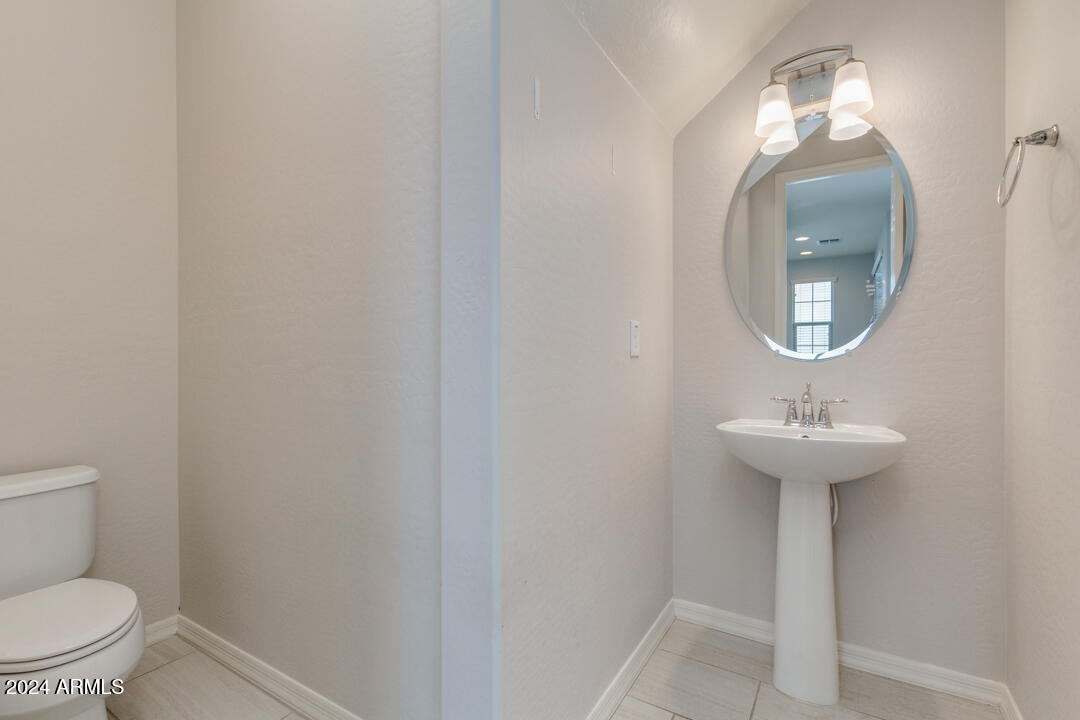 3661 East STILES Lane Gilbert, AZ 85295 - Photo 16 of 38 a bathroom with a sink and a mirror