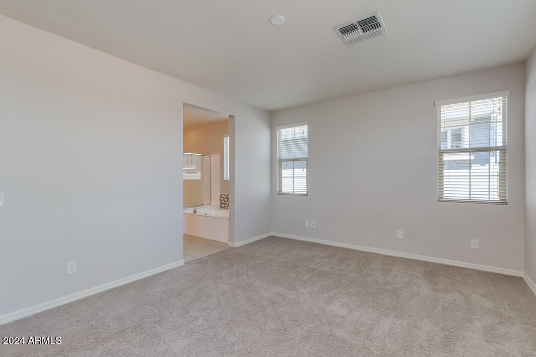 3661 East STILES Lane Gilbert, AZ 85295 - Photo 18 of 38 an empty room with windows