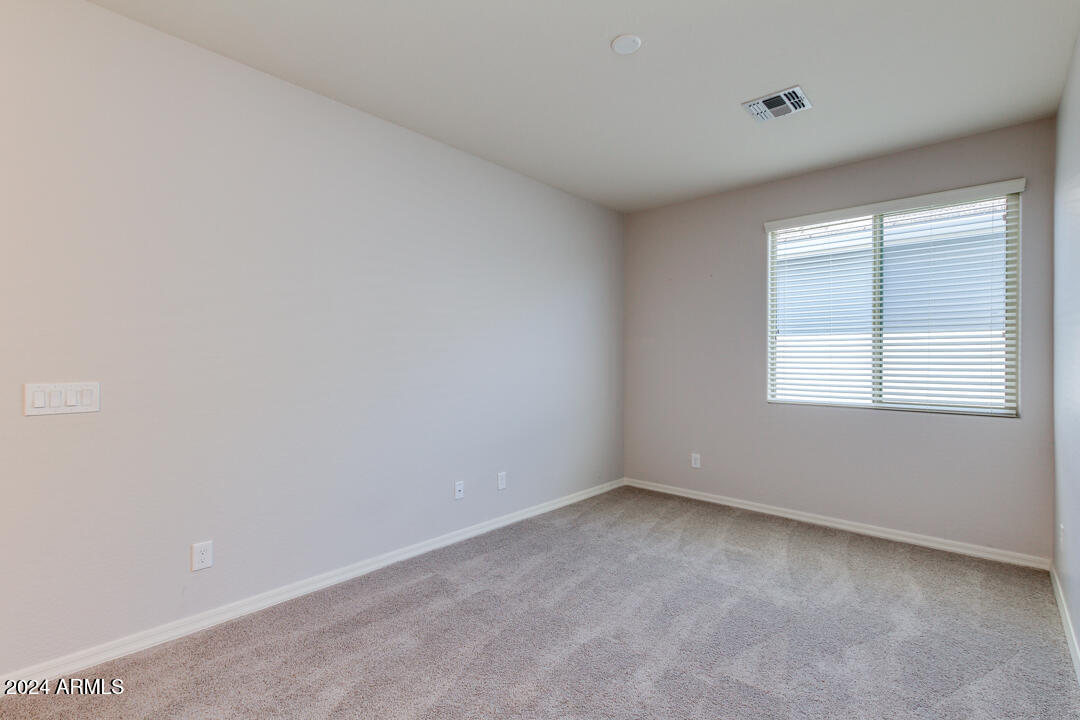 3661 East STILES Lane Gilbert, AZ 85295 - Photo 23 of 38 an empty room with a window
