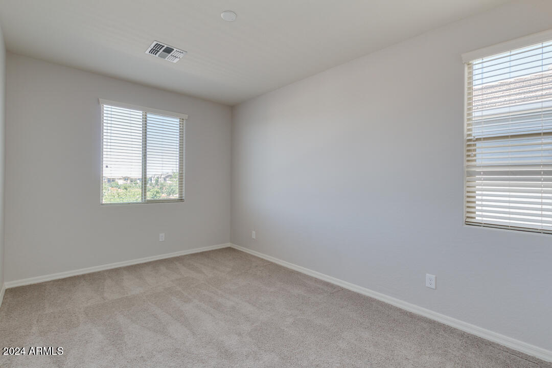 3661 East STILES Lane Gilbert, AZ 85295 - Photo 26 of 38 an empty room with windows