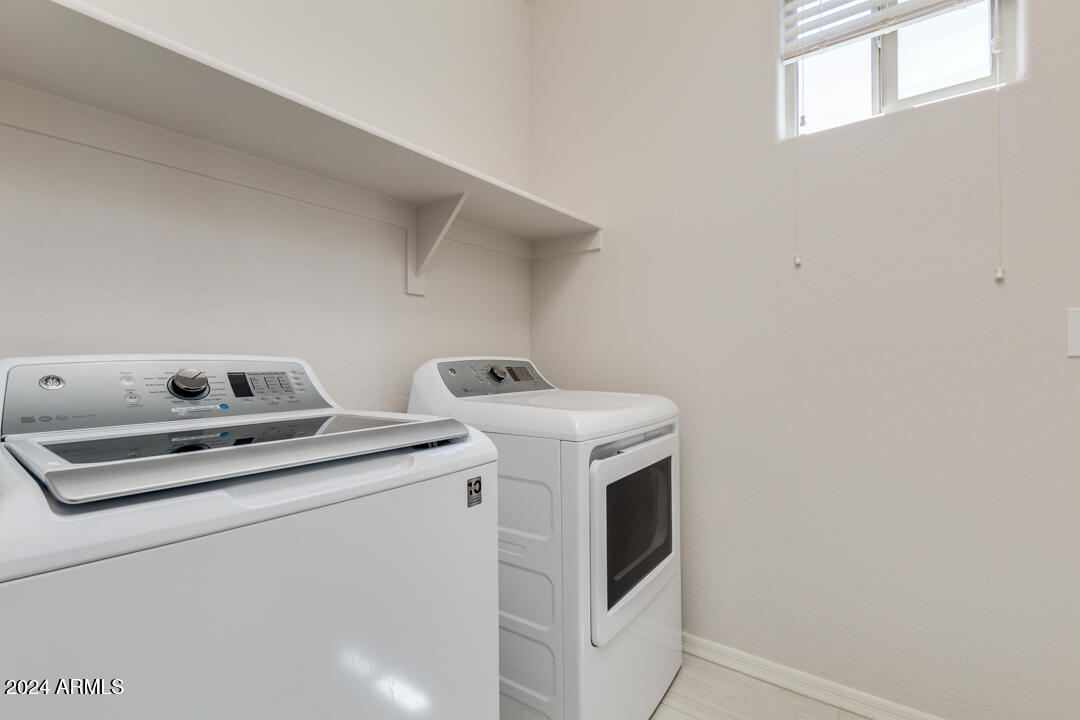 3661 East STILES Lane Gilbert, AZ 85295 - Photo 28 of 38 a utility room with dryer and washer