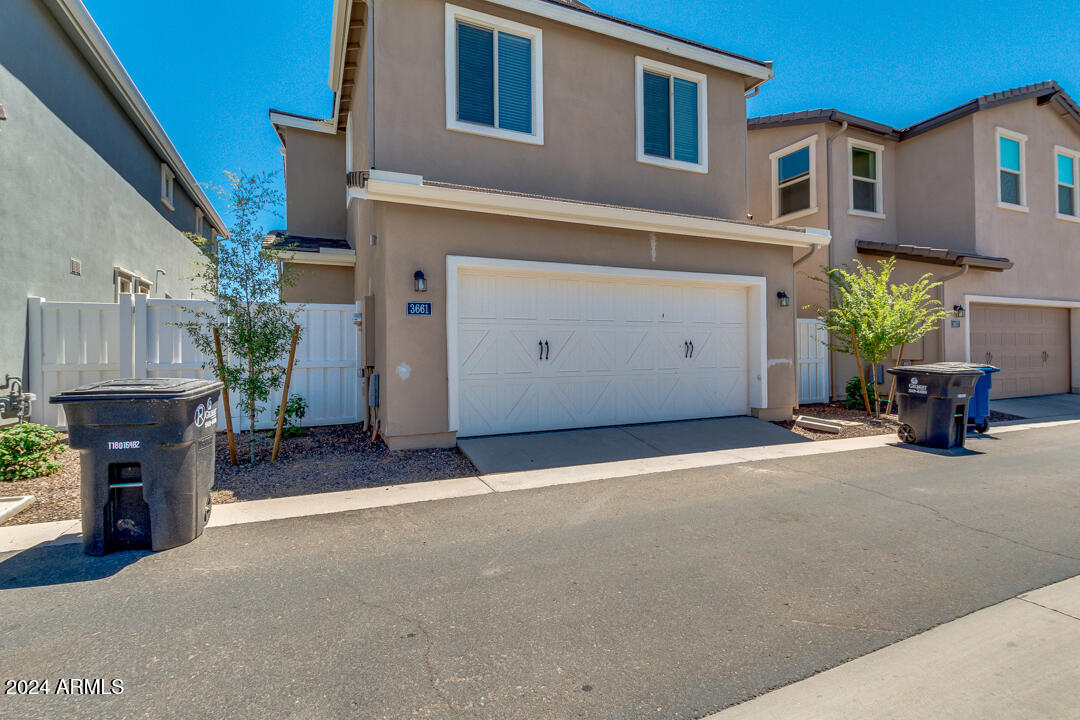 3661 East STILES Lane Gilbert, AZ 85295 - Photo 35 of 38 a backyard of a house with seating space and a street