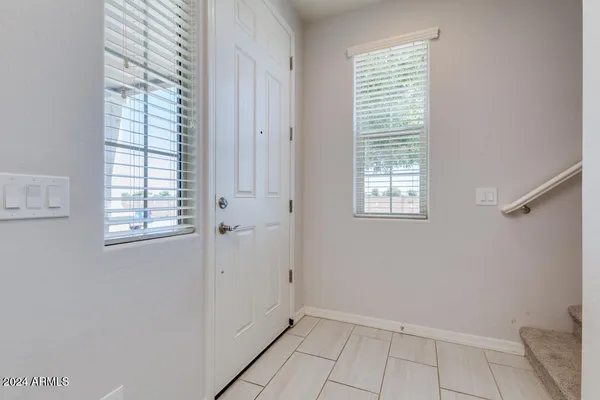 a kitchen with granite countertop cabinets and window