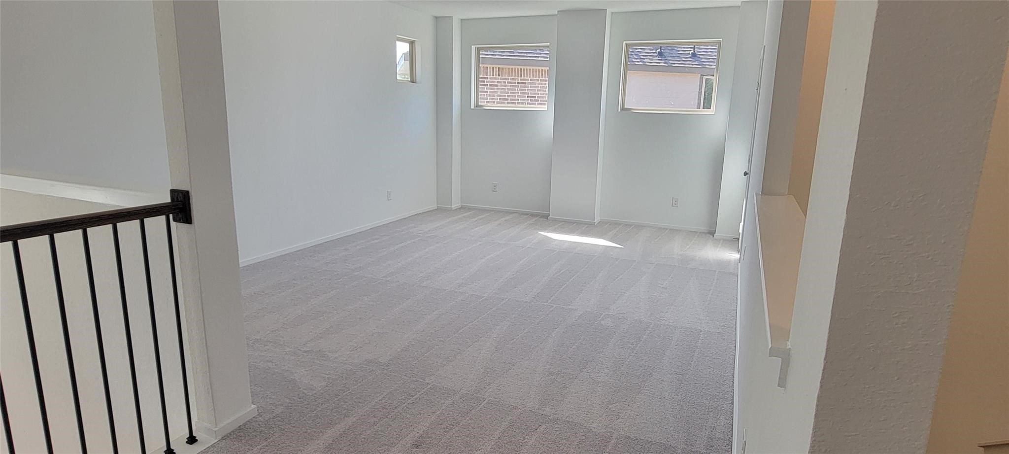 31119 Riley Hts Drive Fulshear, TX 77441 - Photo 10 of 34 a view of a hallway with windows