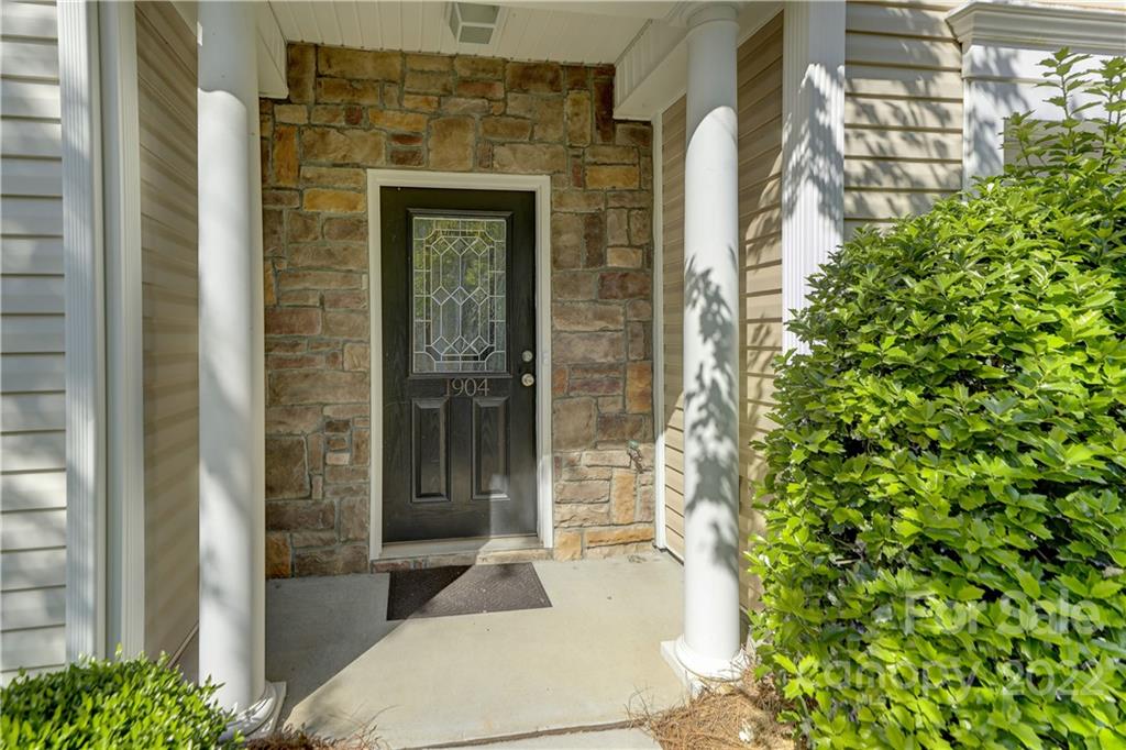 1904 Travertine Lane Fort Mill, SC 29708 - Photo 6 of 45 a entryway with a glass door