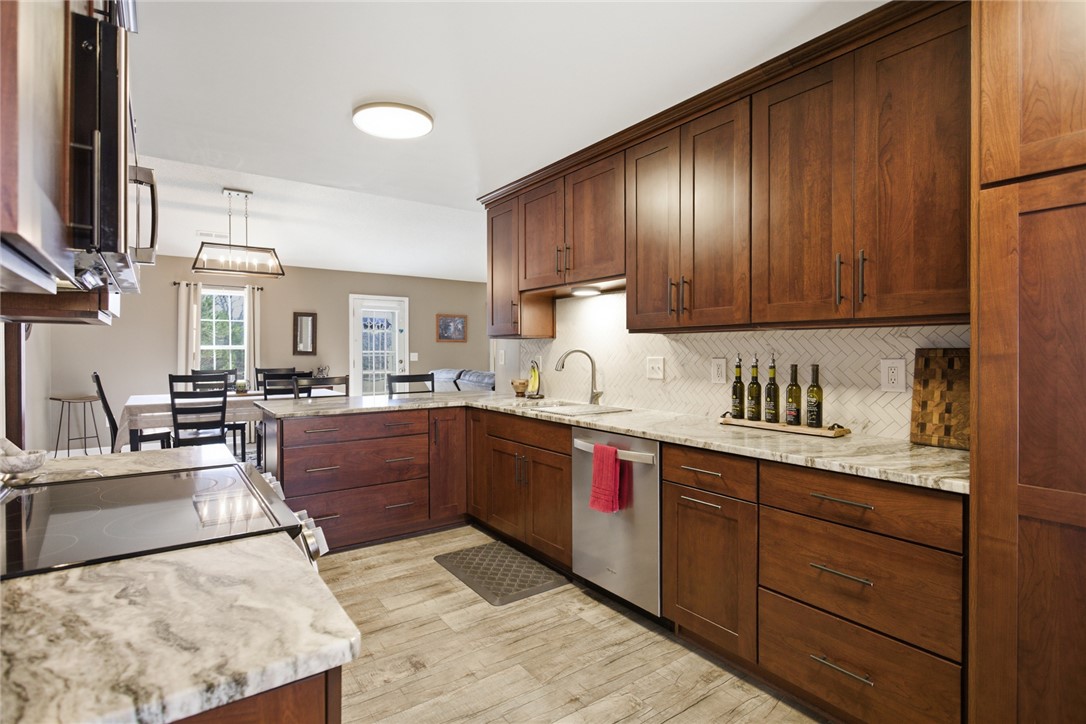 158 State Rd S-37-175 Seneca, SC 29672 - Photo 10 of 43 This thoughtfully designed kitchen boasts ample storage and a seamless connection to the dining area.