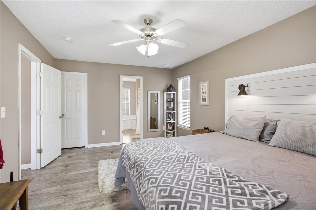158 State Rd S-37-175 Seneca, SC 29672 - Photo 16 of 43 This spacious bedroom features warm neutral tones, durable flooring, and ample natural light.