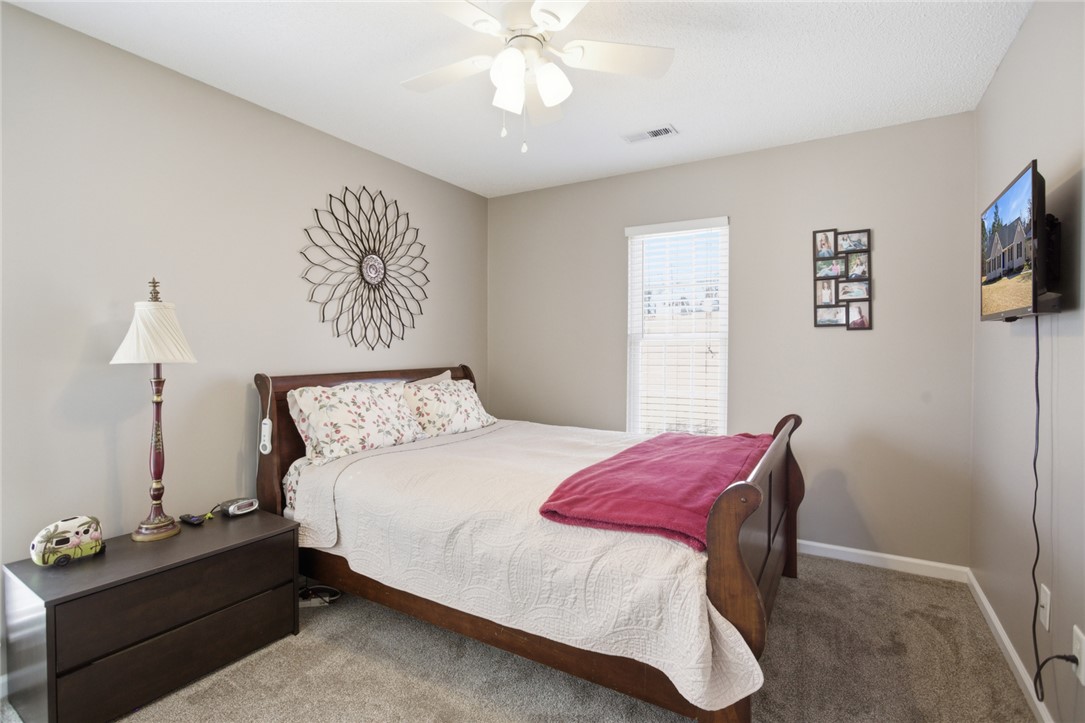 158 State Rd S-37-175 Seneca, SC 29672 - Photo 21 of 43 This cozy bedroom offers a serene retreat with carpeted flooring and abundant natural light.