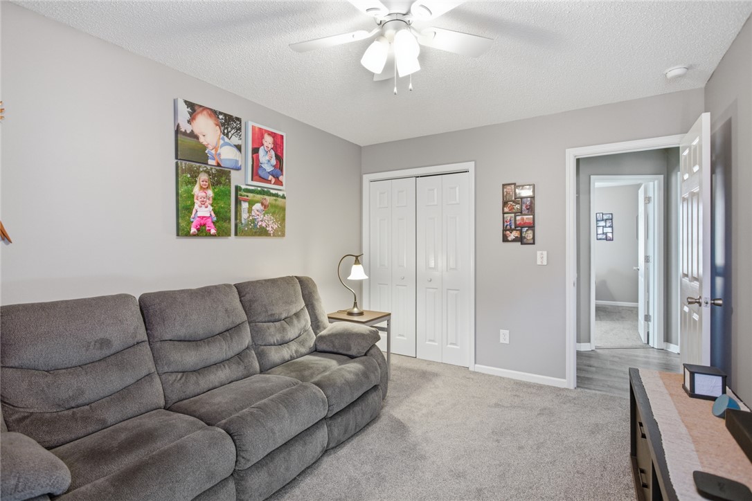 158 State Rd S-37-175 Seneca, SC 29672 - Photo 24 of 43 This inviting room features a practical layout with comfortable carpeting and a cooling ceiling fan.