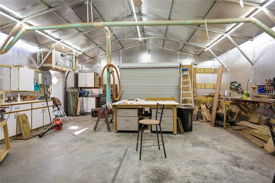 158 State Rd S-37-175 Seneca, SC 29672 - Photo 29 of 43 This spacious garage offers ample room for projects and storage, featuring a concrete floor for durability.