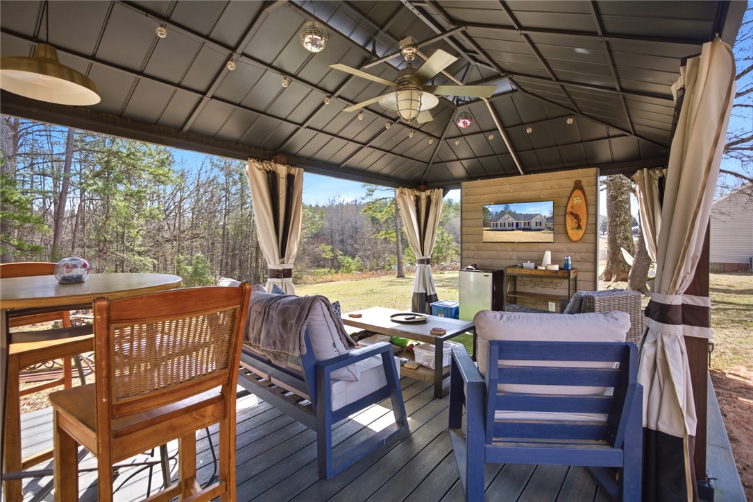 158 State Rd S-37-175 Seneca, SC 29672 - Photo 30 of 43 This spacious covered patio offers comfortable outdoor living with scenic natural views.