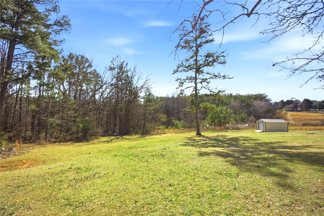 158 State Rd S-37-175 Seneca, SC 29672 - Photo 33 of 43 Expansive green yard offering ample space for outdoor enjoyment and potential.