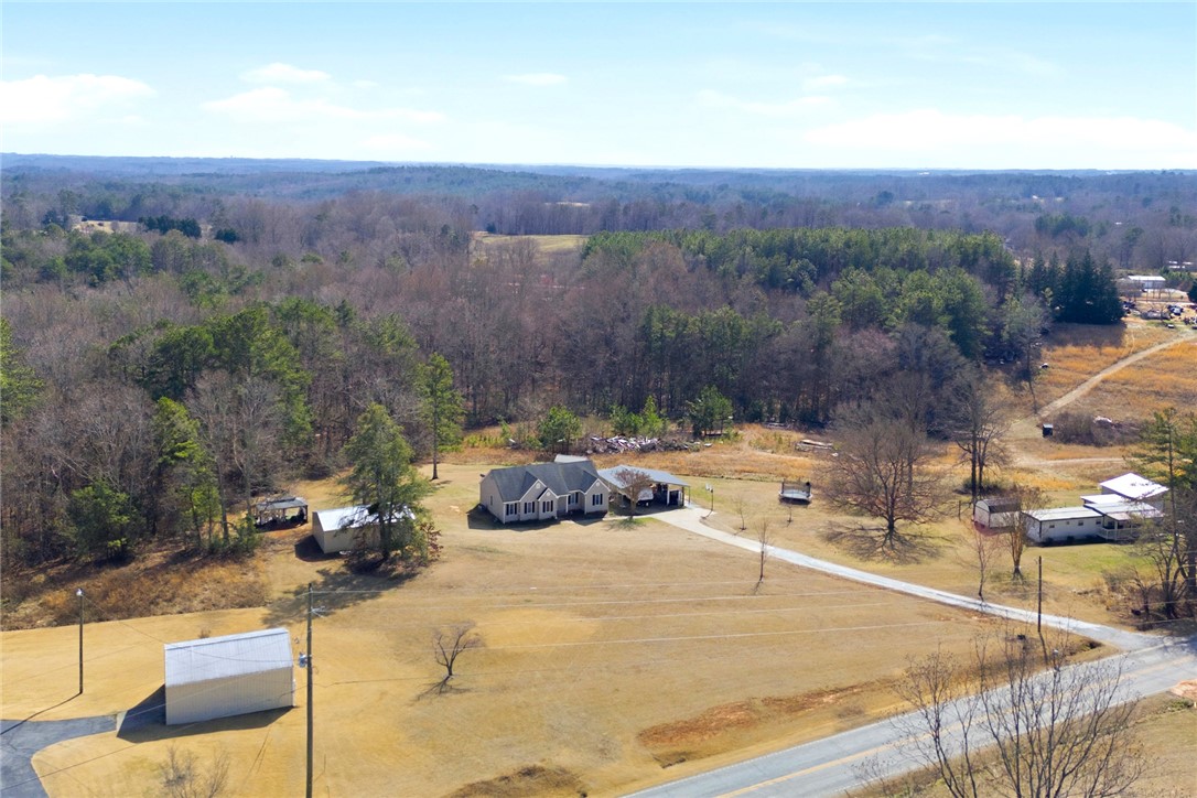 158 State Rd S-37-175 Seneca, SC 29672 - Photo 34 of 43 This expansive property features a charming home nestled within a serene, wooded landscape.