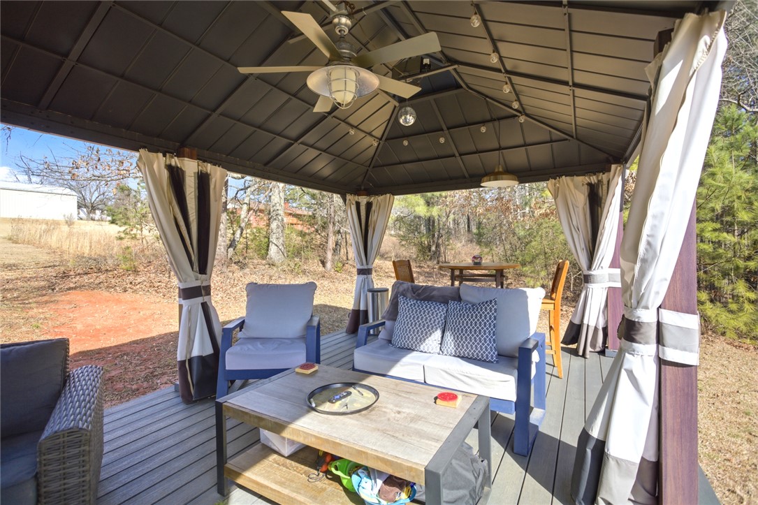 158 State Rd S-37-175 Seneca, SC 29672 - Photo 4 of 43 This inviting patio gazebo offers comfortable outdoor living with ample space for relaxation.