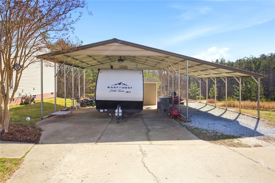 158 State Rd S-37-175 Seneca, SC 29672 - Photo 5 of 43 This spacious covered carport offers ample parking and storage for recreational vehicles.