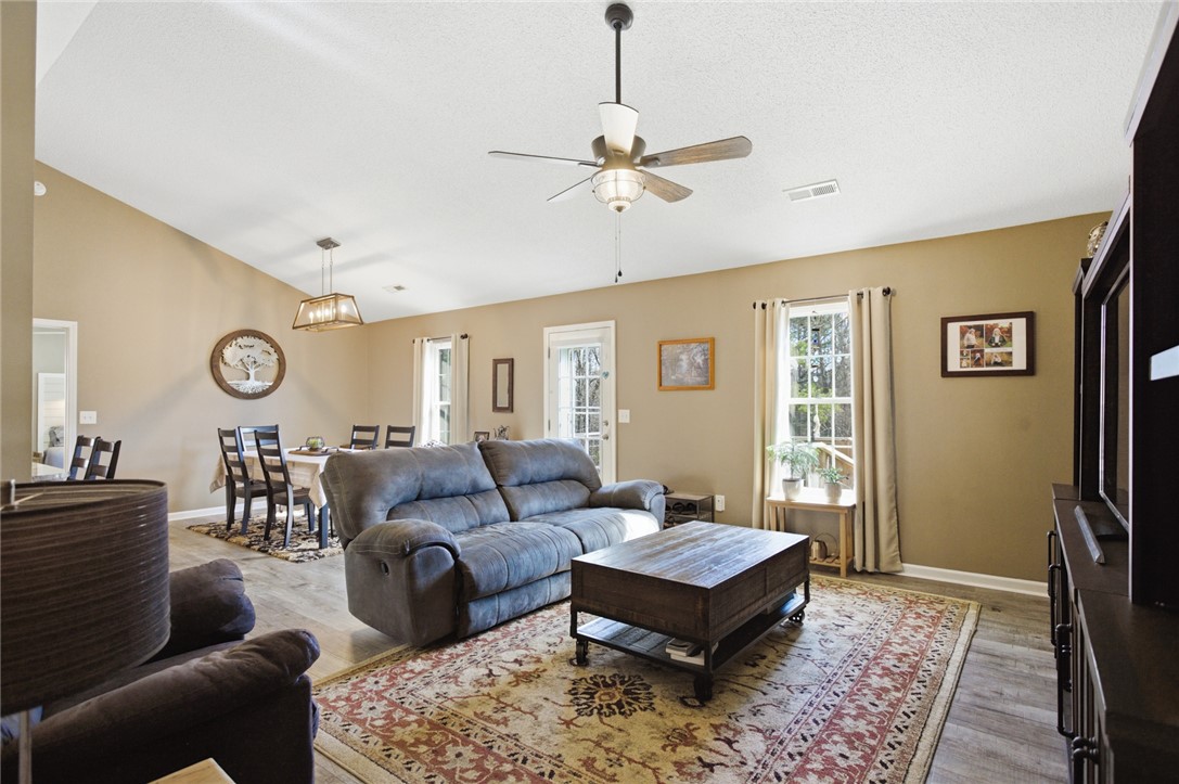 158 State Rd S-37-175 Seneca, SC 29672 - Photo 42 of 43 This inviting living space features high ceilings and an open floor plan, ideal for entertaining.