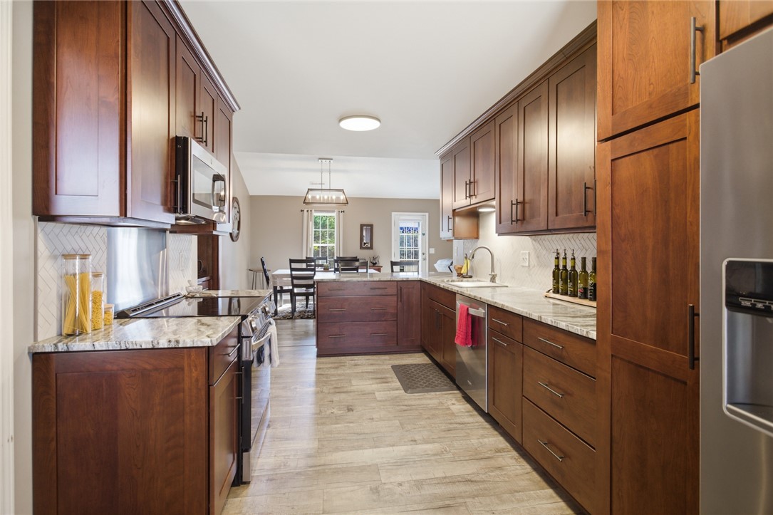 158 State Rd S-37-175 Seneca, SC 29672 - Photo 8 of 43 This spacious kitchen offers ample cabinet space and modern appliances, perfect for everyday living.