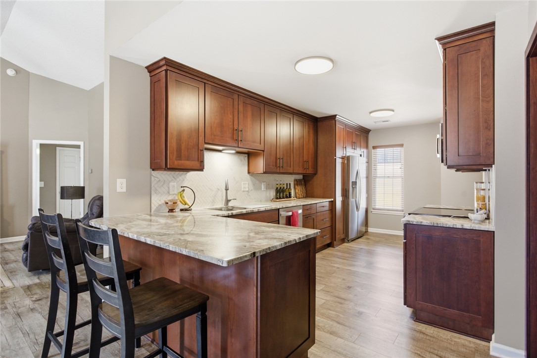 158 State Rd S-37-175 Seneca, SC 29672 - Photo 9 of 43 This modern kitchen features rich cabinetry, beautiful countertops, and contemporary appliances.