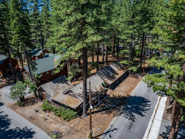 front view of a house with a tree