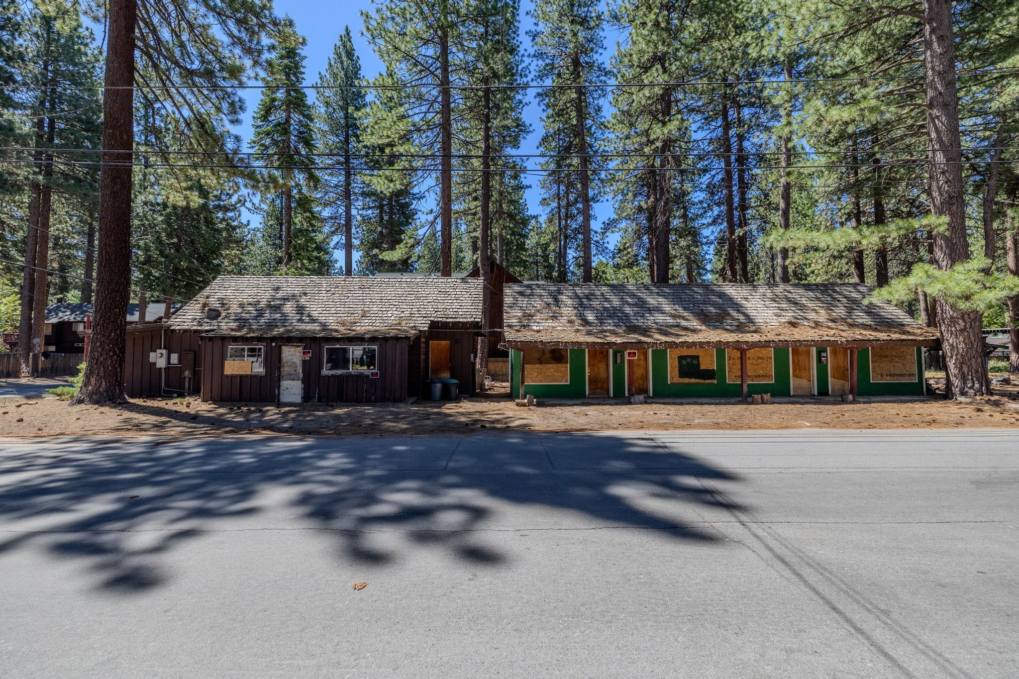 441 Bear Street Kings Beach, CA 96143 - Photo 4 of 26 a view of a big house with large trees and a barn